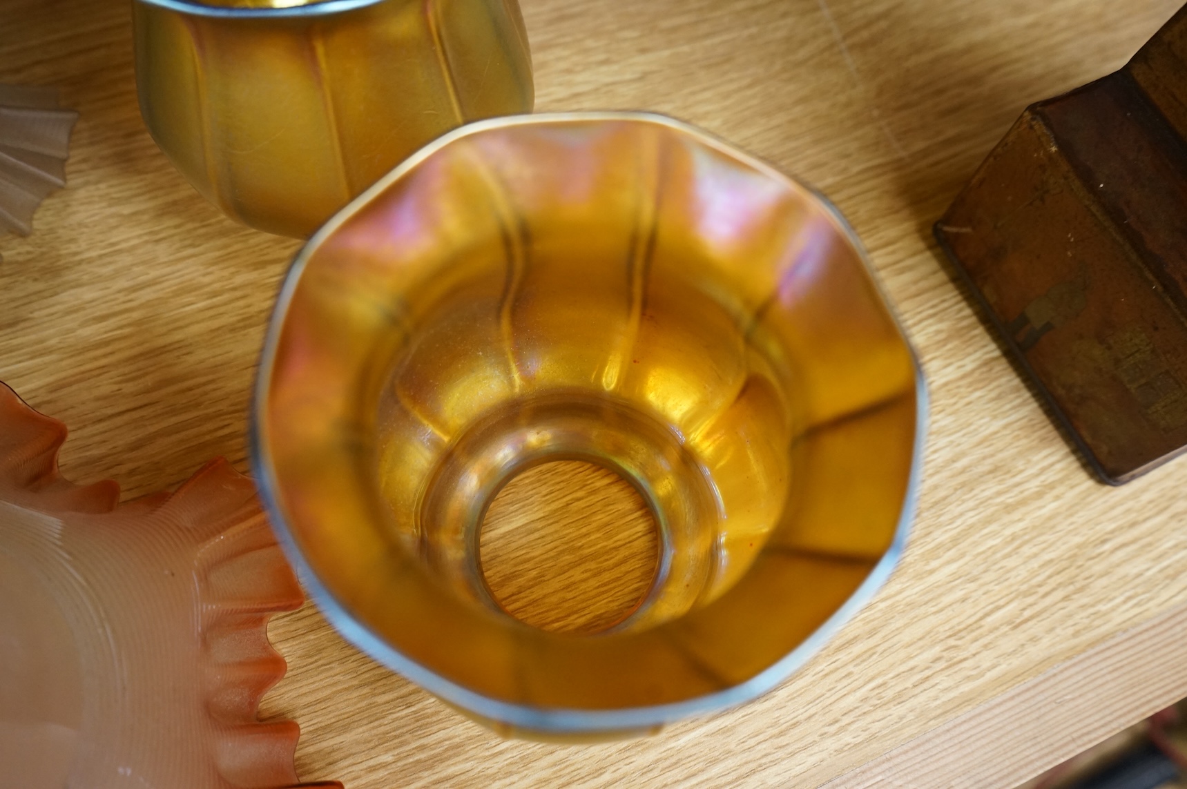 A pair of Quezal Art Glass iridescent light shades, and two frilled edged shades, Quezal shades 11.5cm high